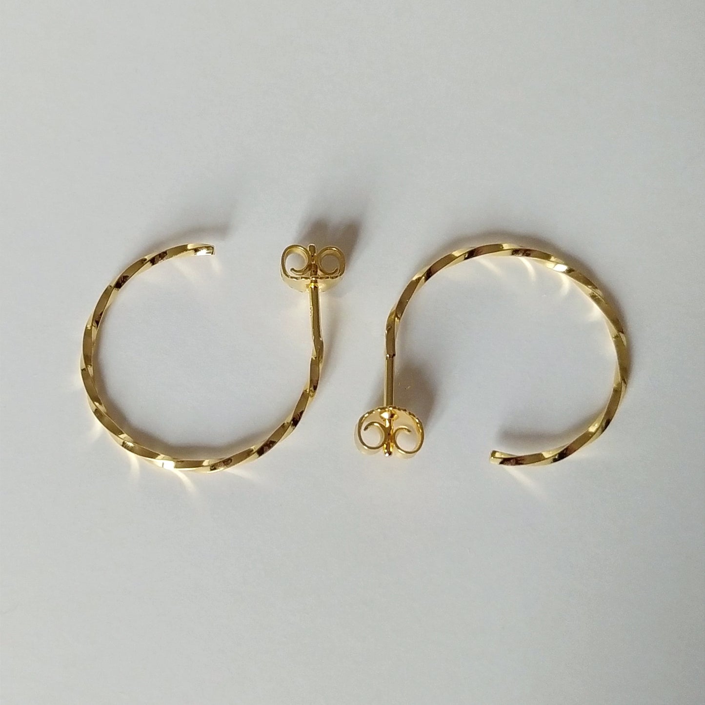 Carey | golden big twisted hoop ear studs