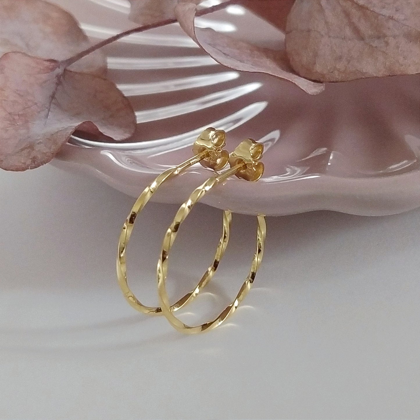 Carey | golden big twisted hoop ear studs