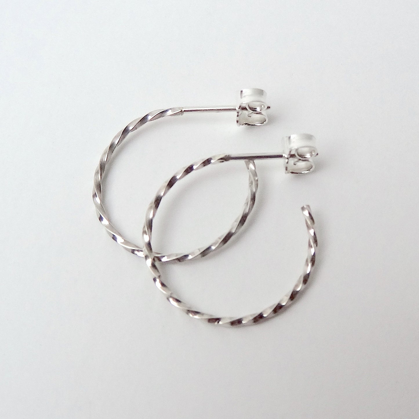 Carey | golden big twisted hoop ear studs