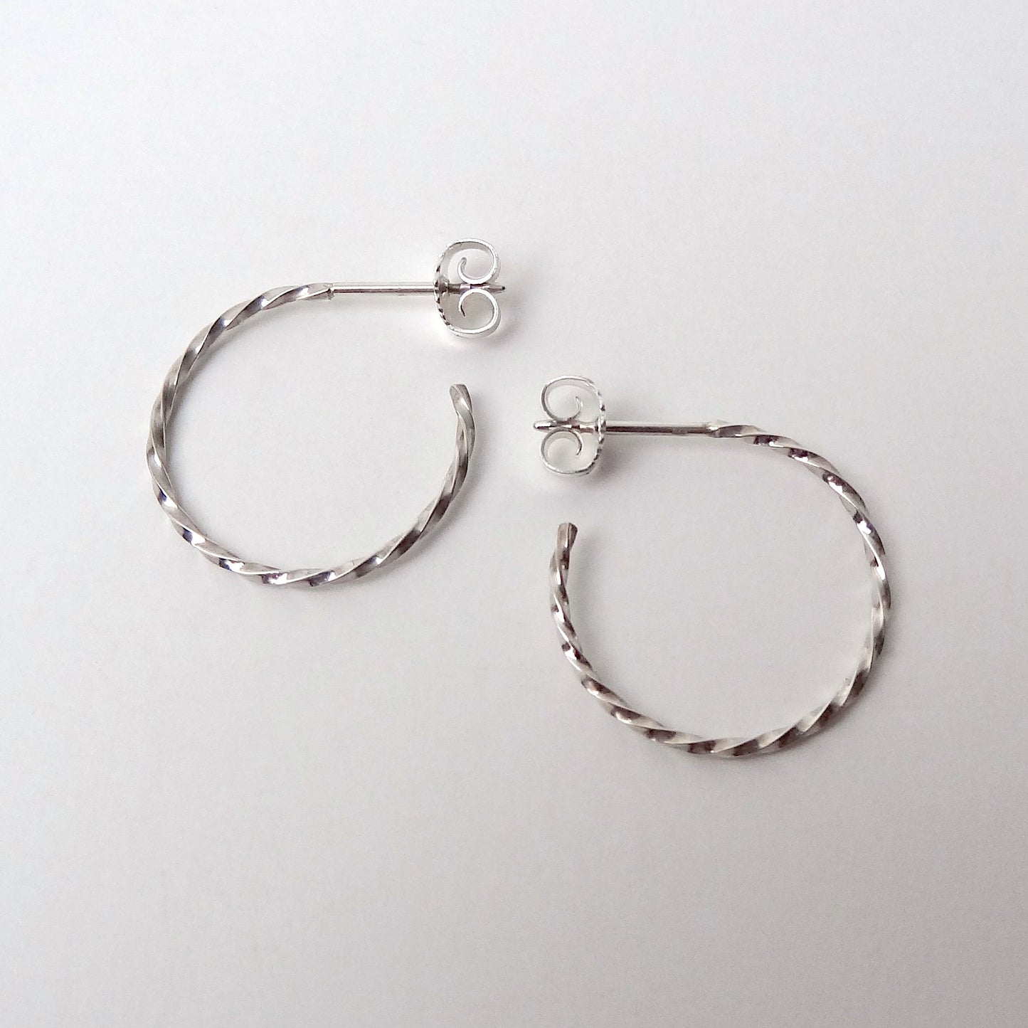 Carey | golden big twisted hoop ear studs