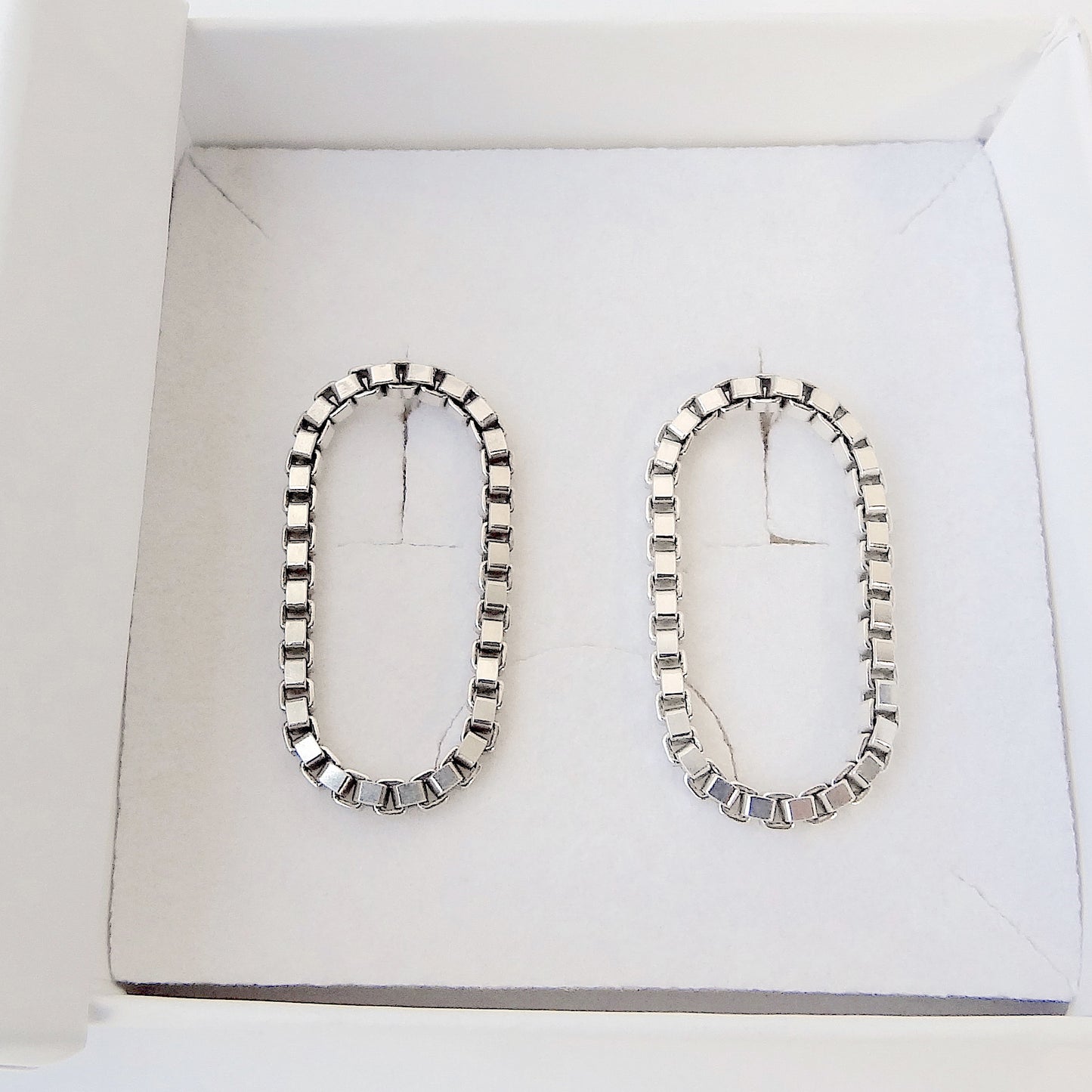 Sira | hanging oval chain earrings