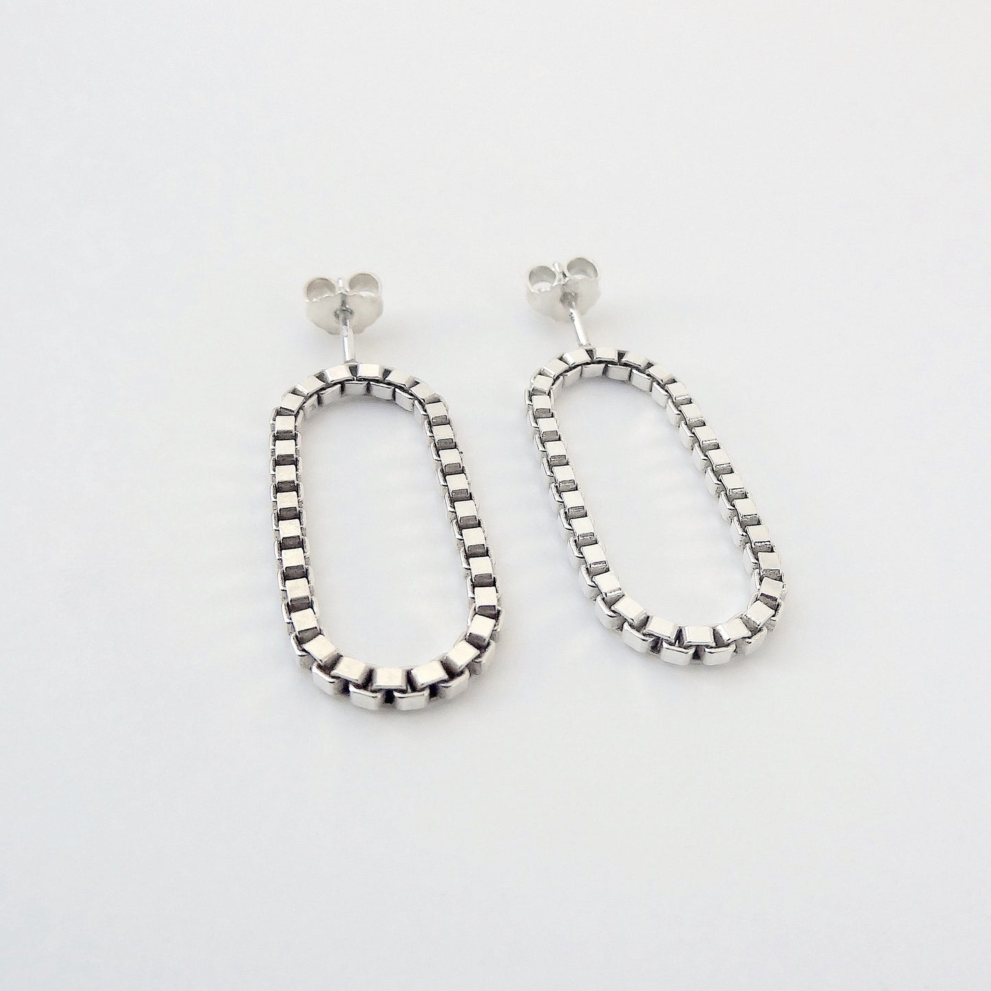 Sira | hanging oval chain earrings