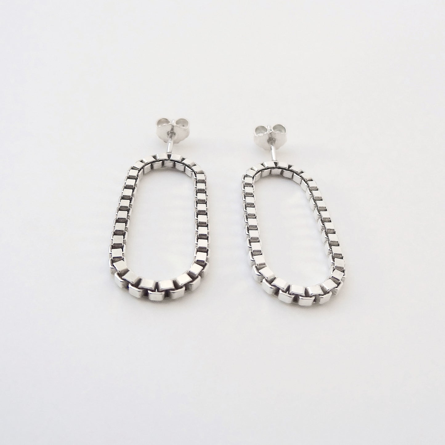 Sira | hanging oval chain earrings