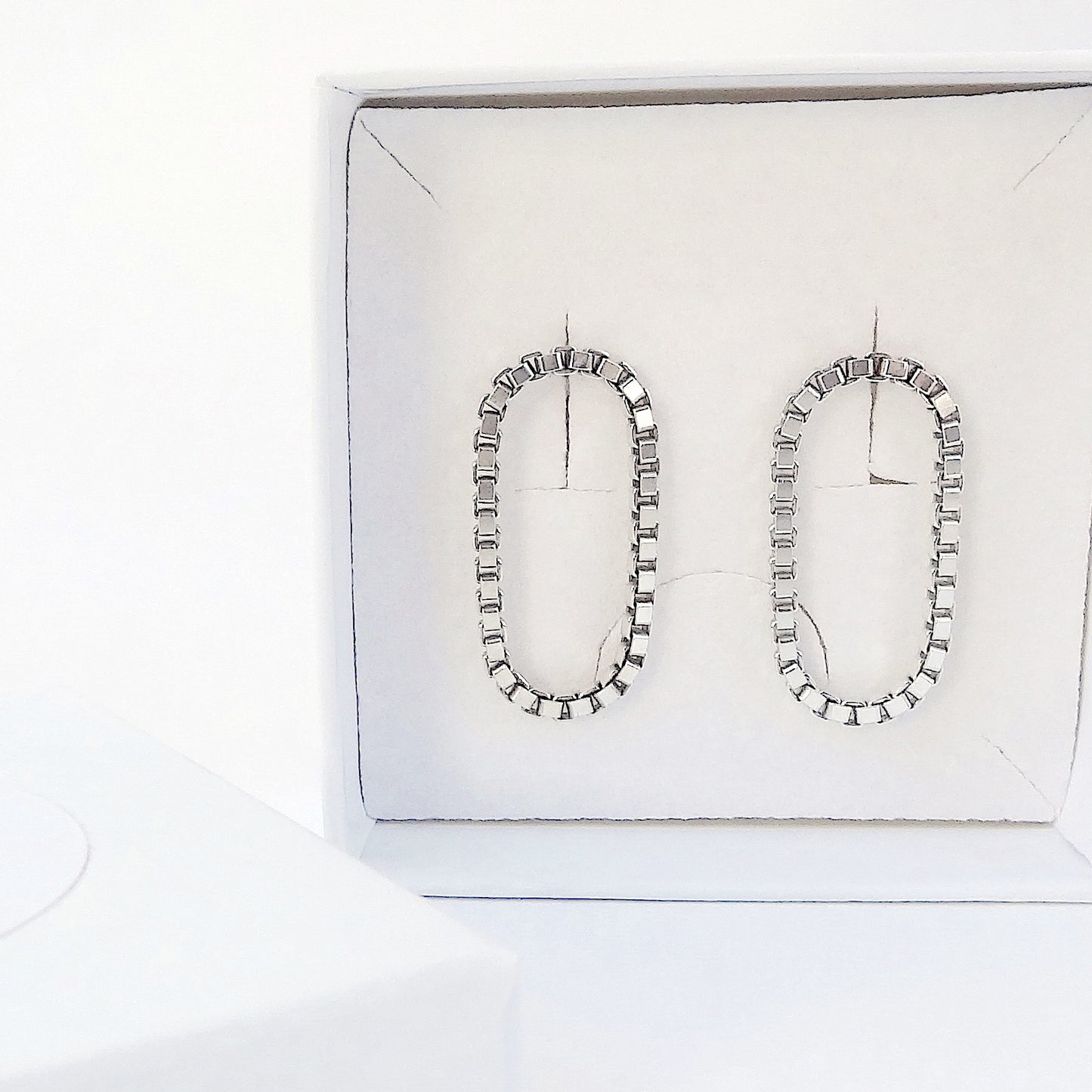Sira | hanging oval chain earrings