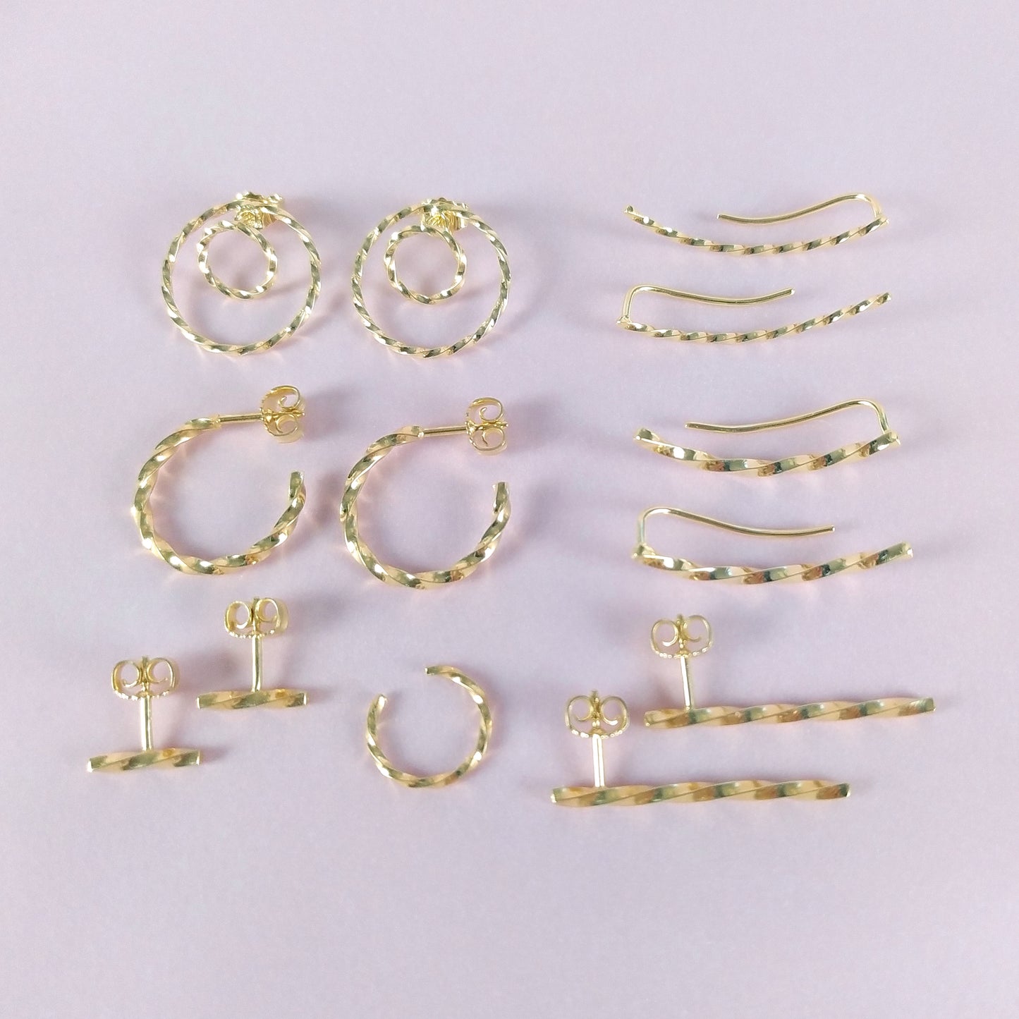 Adeja | golden twisted bar stud earrings